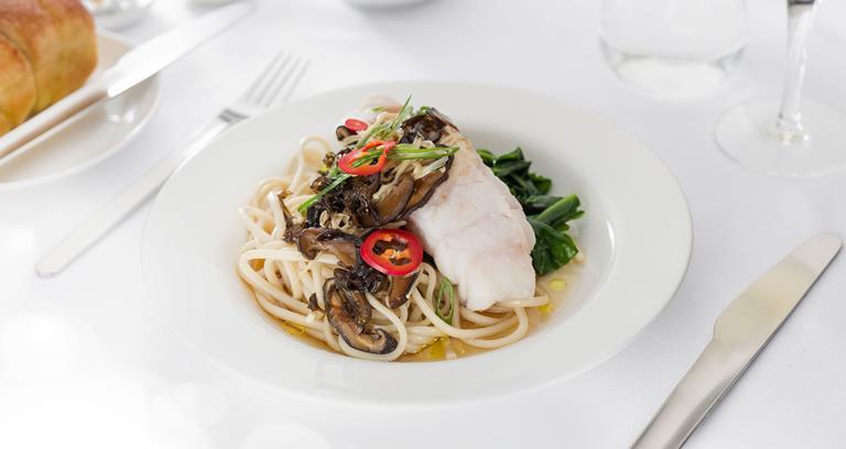 Jiangsu-style steamed blue eye with bacon and mushroom broth, wheat noodles and Asian greens