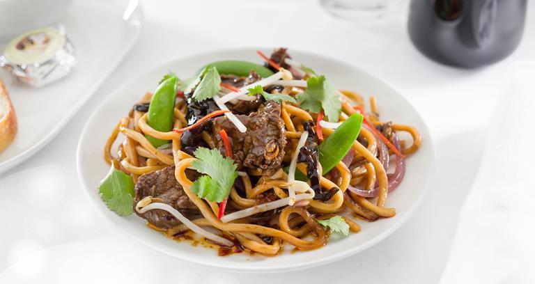 Stir-fried beef with oyster sauce, hokkien noodles, shiitake, black fungus, sesame and sugar snaps
